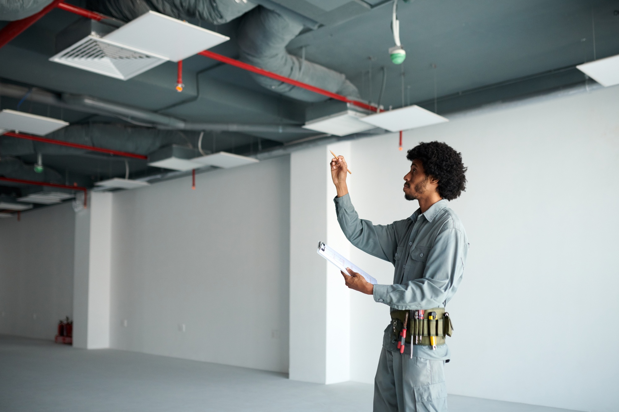 Contractor Inspecting Ventilation Pipes