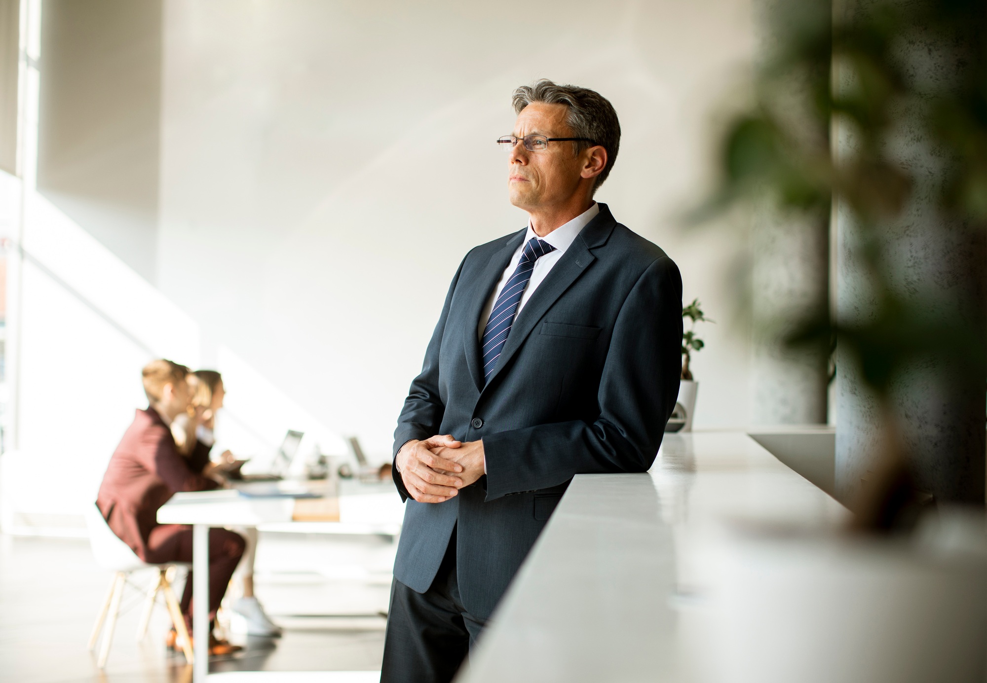 Handsome business man standing in the office